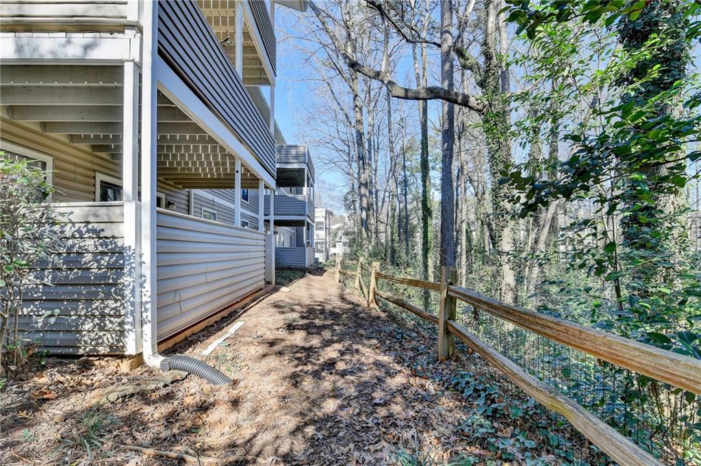 516 Wynnes Ridge Circle Southeast, Unit 516 Marietta, GA 30067 - Photo 35 of 40 a view of a house with a tree beside it