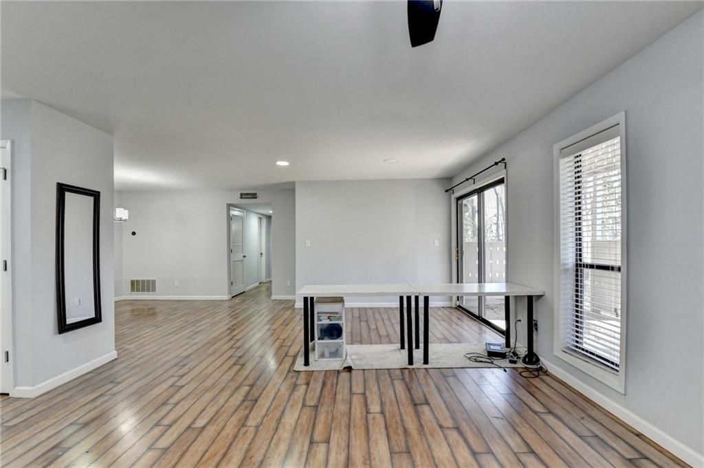 516 Wynnes Ridge Circle Southeast, Unit 516 Marietta, GA 30067 - Photo 7 of 40 a view of livingroom with furniture wooden floor and windows