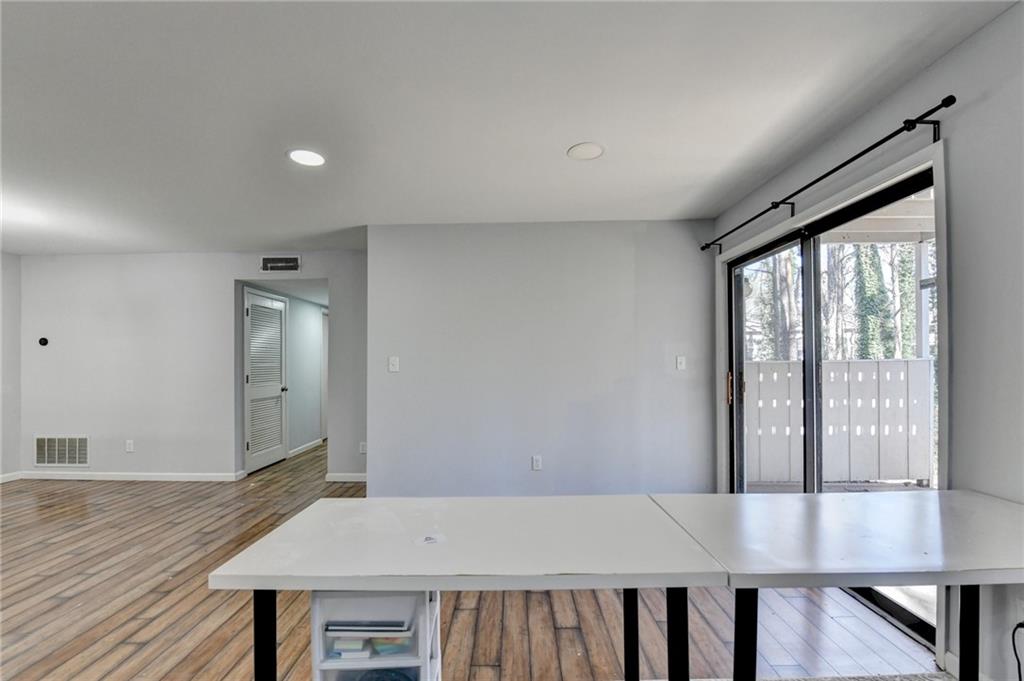 516 Wynnes Ridge Circle Southeast, Unit 516 Marietta, GA 30067 - Photo 9 of 40 a view of a hallway with wooden floor