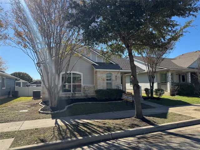 a view of a yard in front of a house