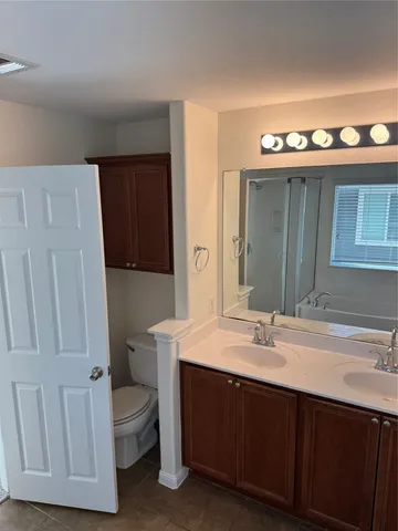 a kitchen with stainless steel appliances granite countertop a refrigerator stove top oven and sink