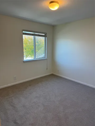 a view of an empty room and entryway