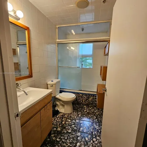 a bathroom with a sink and a toilet