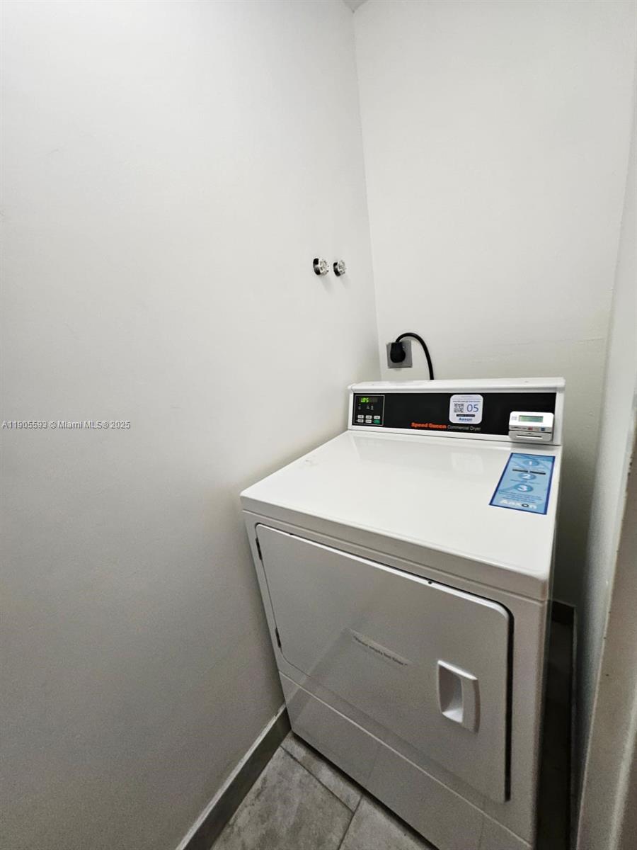 1542 Drexel Avenue, Unit 208 Miami Beach, FL 33139 - Photo 6 of 9 a utility room with dryer and washer
