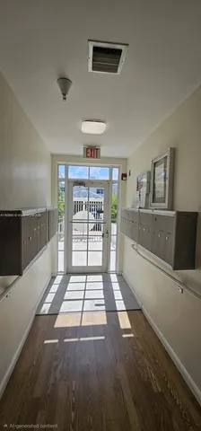 a view of kitchen with refrigerator and window