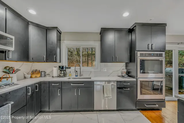 a kitchen with a sink and cabinets