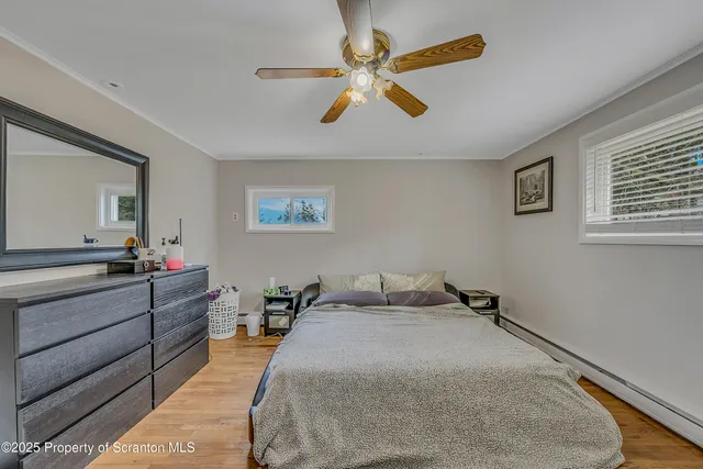 a bed room with a bed and a chandelier