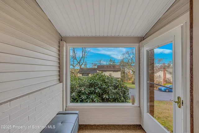 a view of a room that has a large window