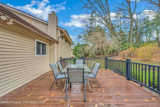 a view of a deck with furniture and wooden floor