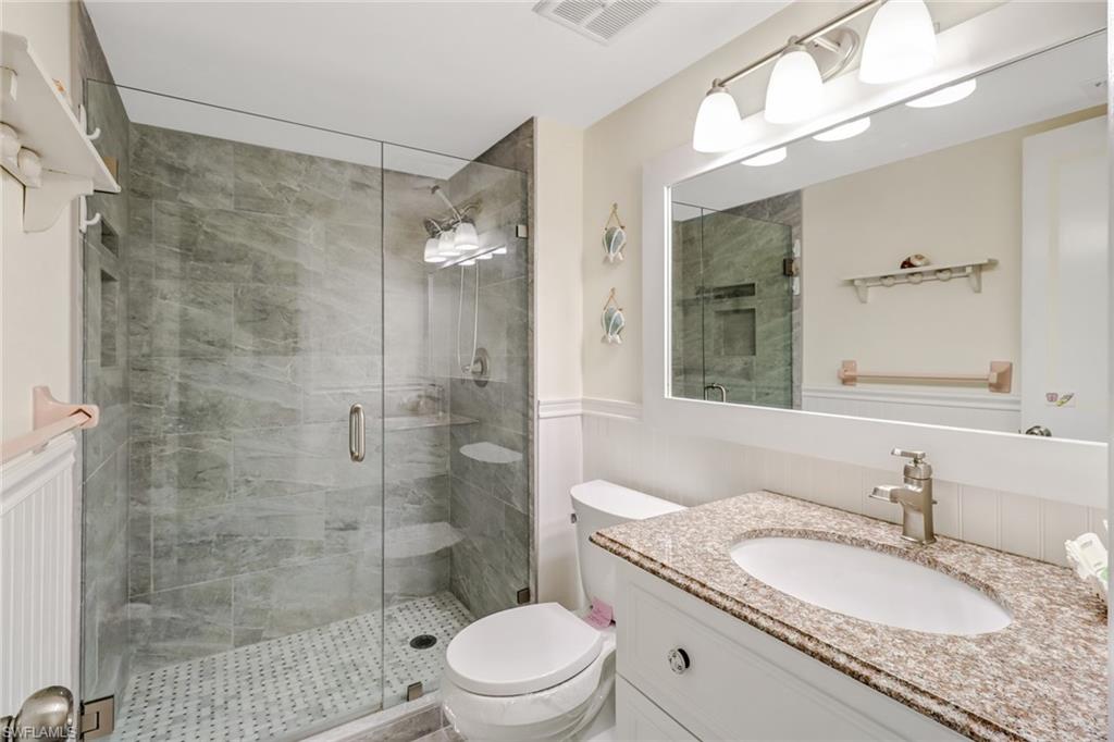 5 High Point Circle West, Unit 211 Naples, FL 34103 - Photo 2 of 44 remodeled main bathroom