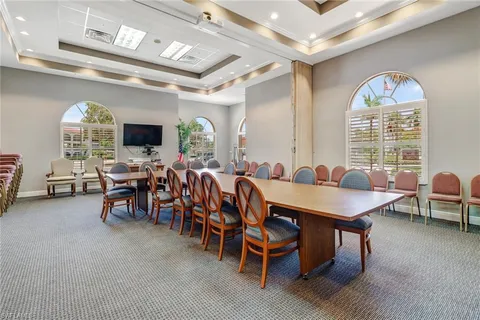 a view of a a dining room with furniture window and outside view
