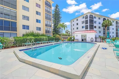 a view of a swimming pool with a lounge chairs