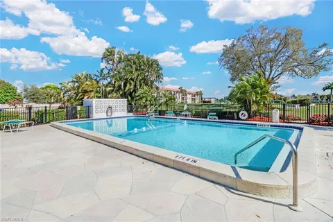 a view of swimming pool with a yard
