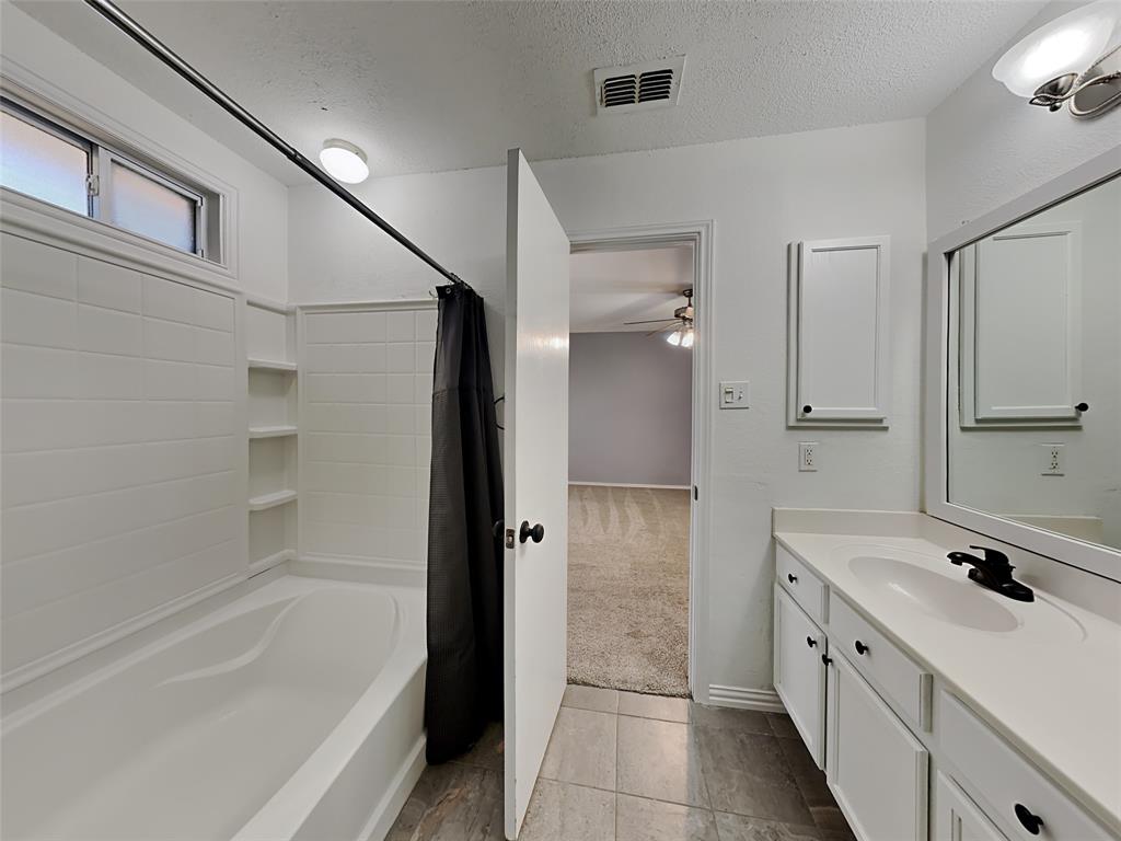 3808 Bandera Ranch Road Fort Worth, TX 76262 - Photo 9 of 15 a bathroom with a bathtub and a sink