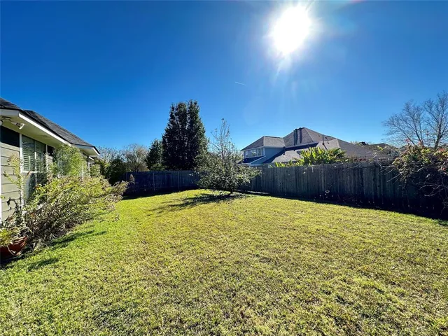 a swimming pool with wooden fence