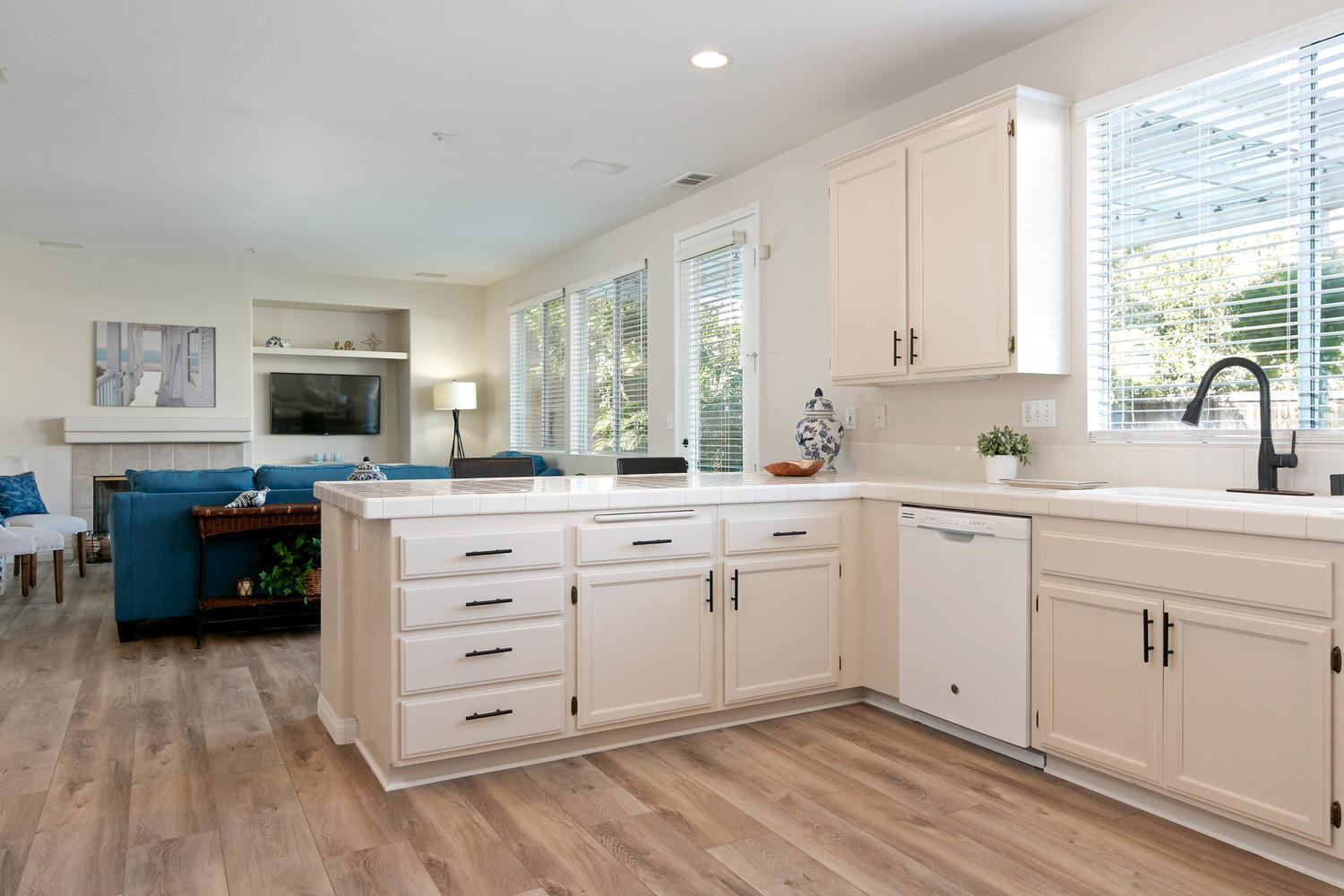 1423 Lorena Drive Oxnard, CA 93030 - Photo 12 of 30 a kitchen with granite countertop a sink cabinets stainless steel appliances and a window
