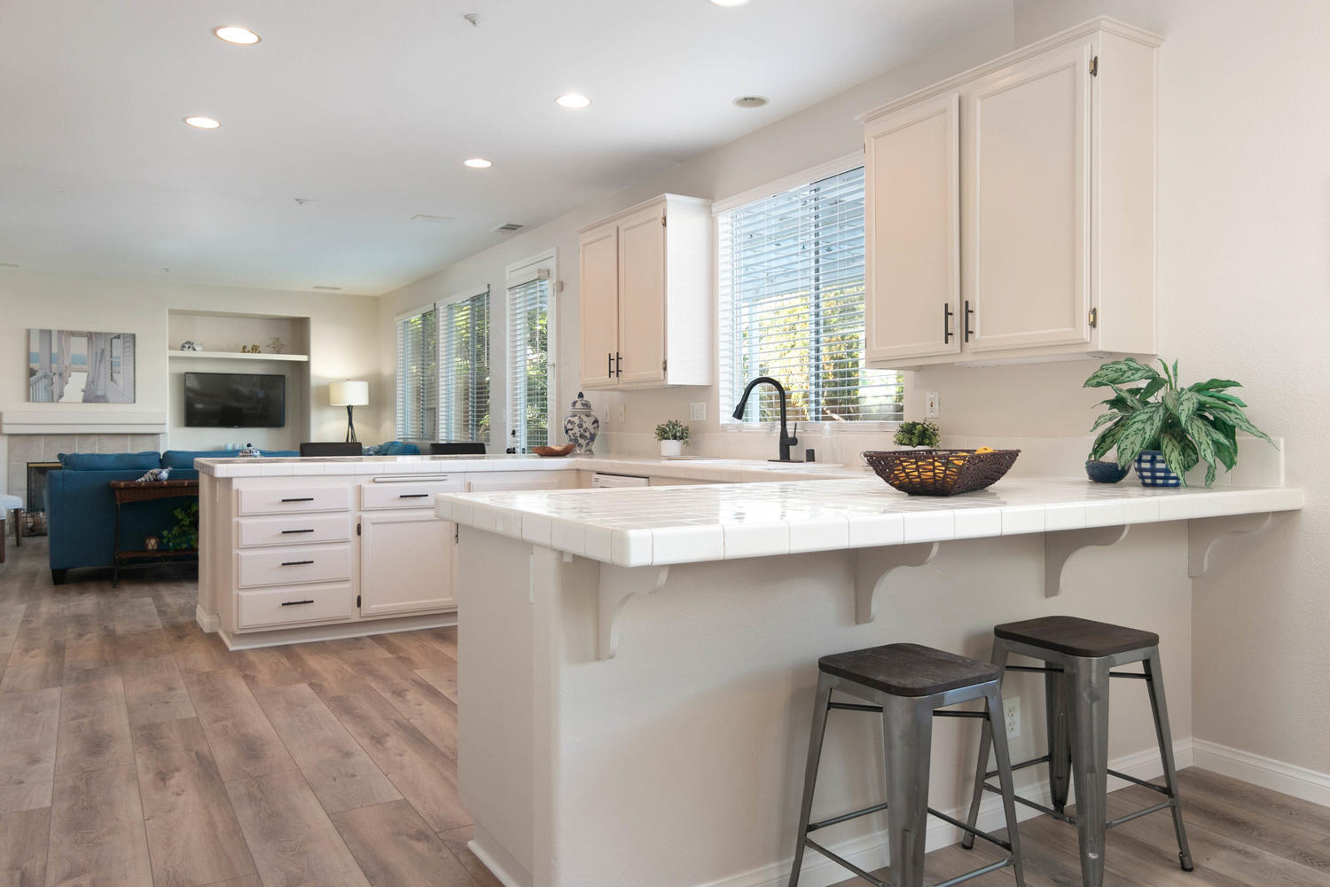 1423 Lorena Drive Oxnard, CA 93030 - Photo 13 of 30 a kitchen with white cabinets and appliances