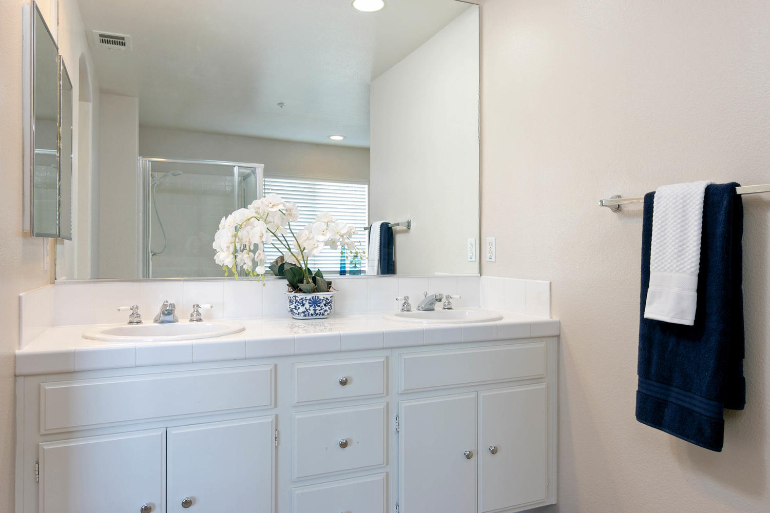 1423 Lorena Drive Oxnard, CA 93030 - Photo 19 of 30 a bathroom with a double vanity sink and mirror