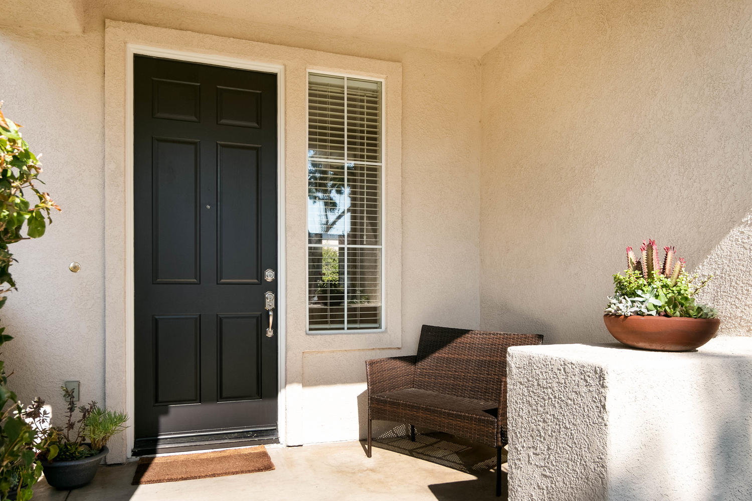 1423 Lorena Drive Oxnard, CA 93030 - Photo 3 of 30 a glass door with a potted plant on a table