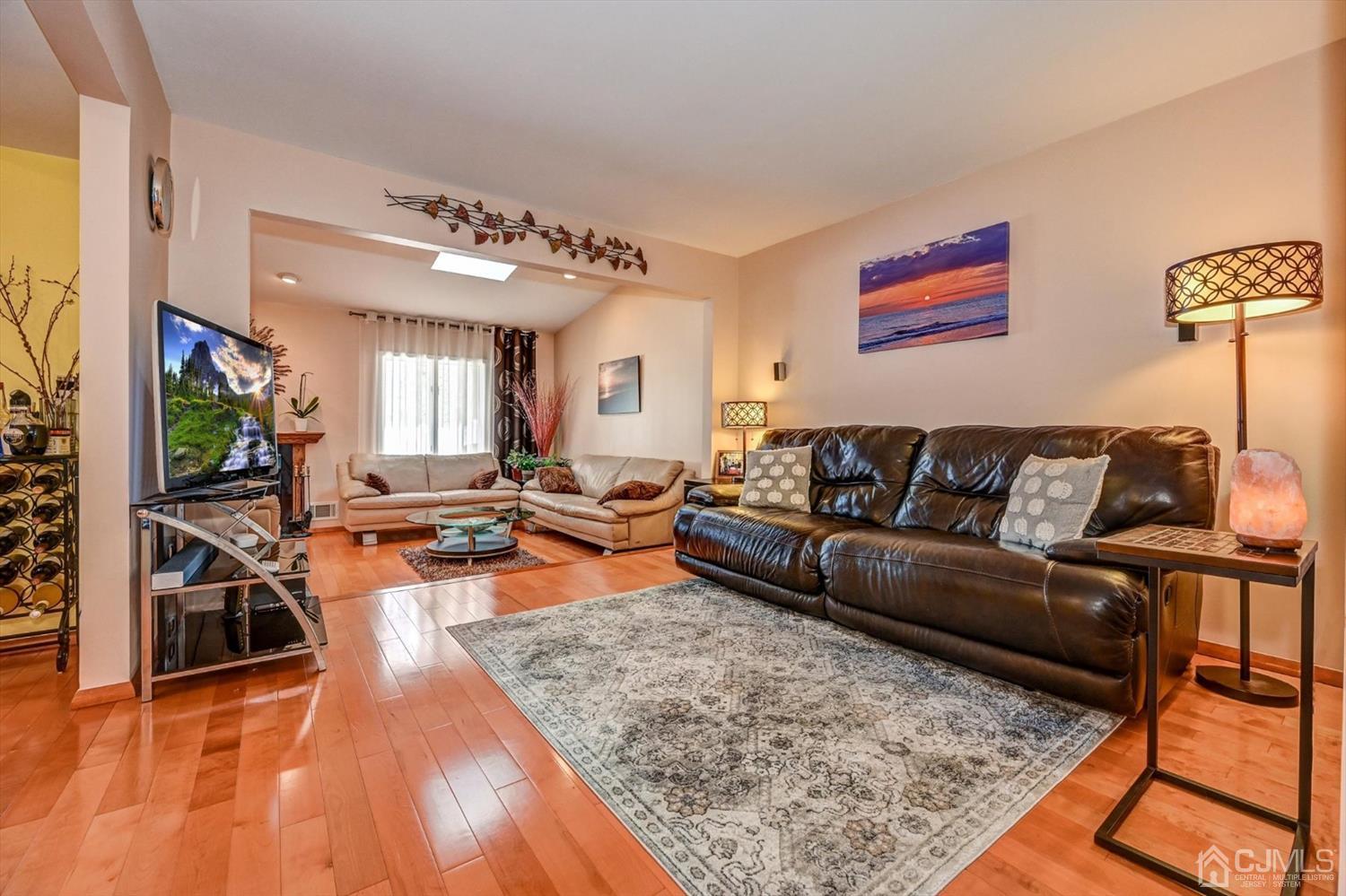 136 Redpine Loop Old Bridge, NJ 08857 - Photo 12 of 31 a living room with furniture and a flat screen tv
