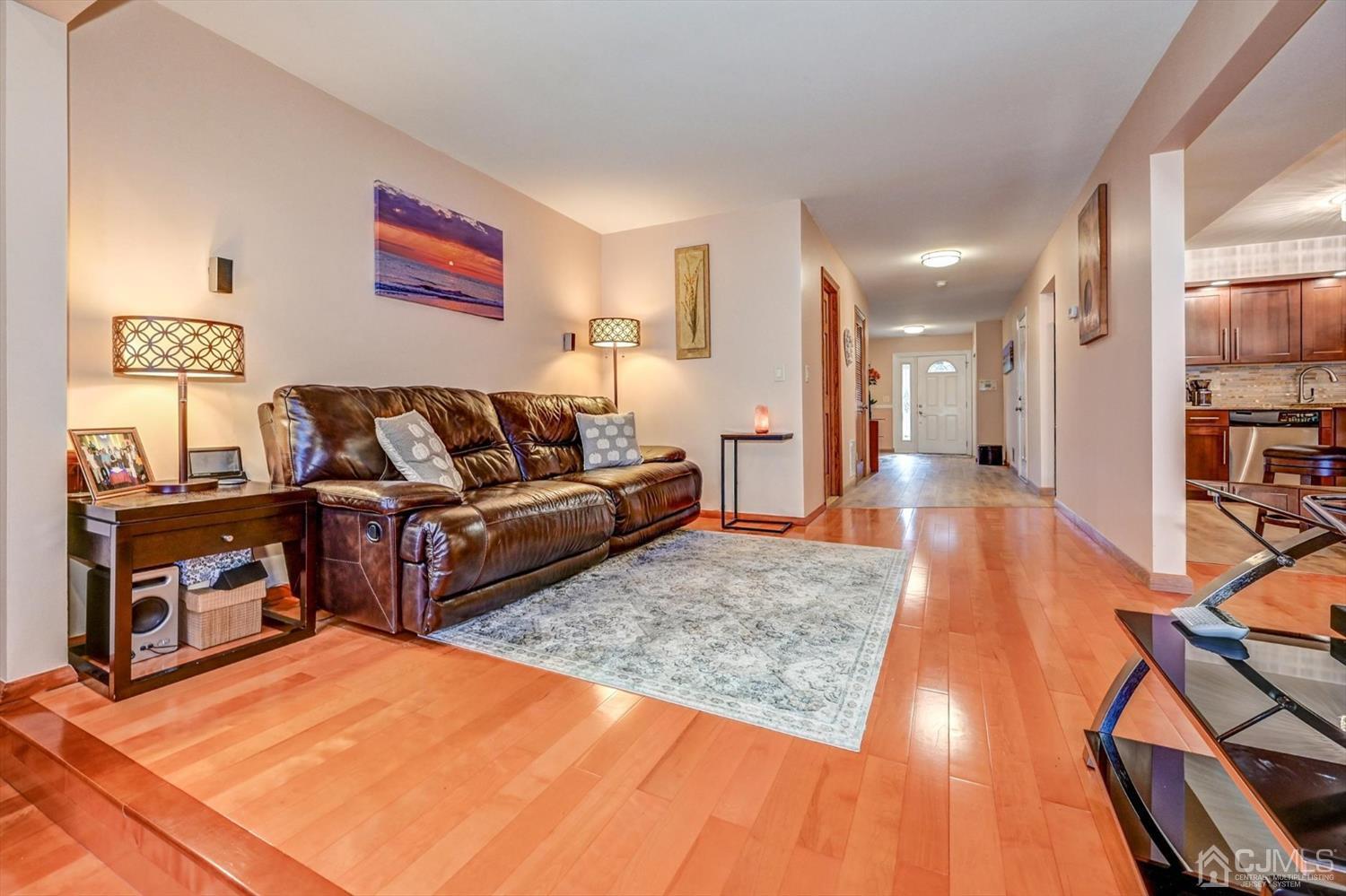 136 Redpine Loop Old Bridge, NJ 08857 - Photo 14 of 31 a living room with furniture and a wooden floor