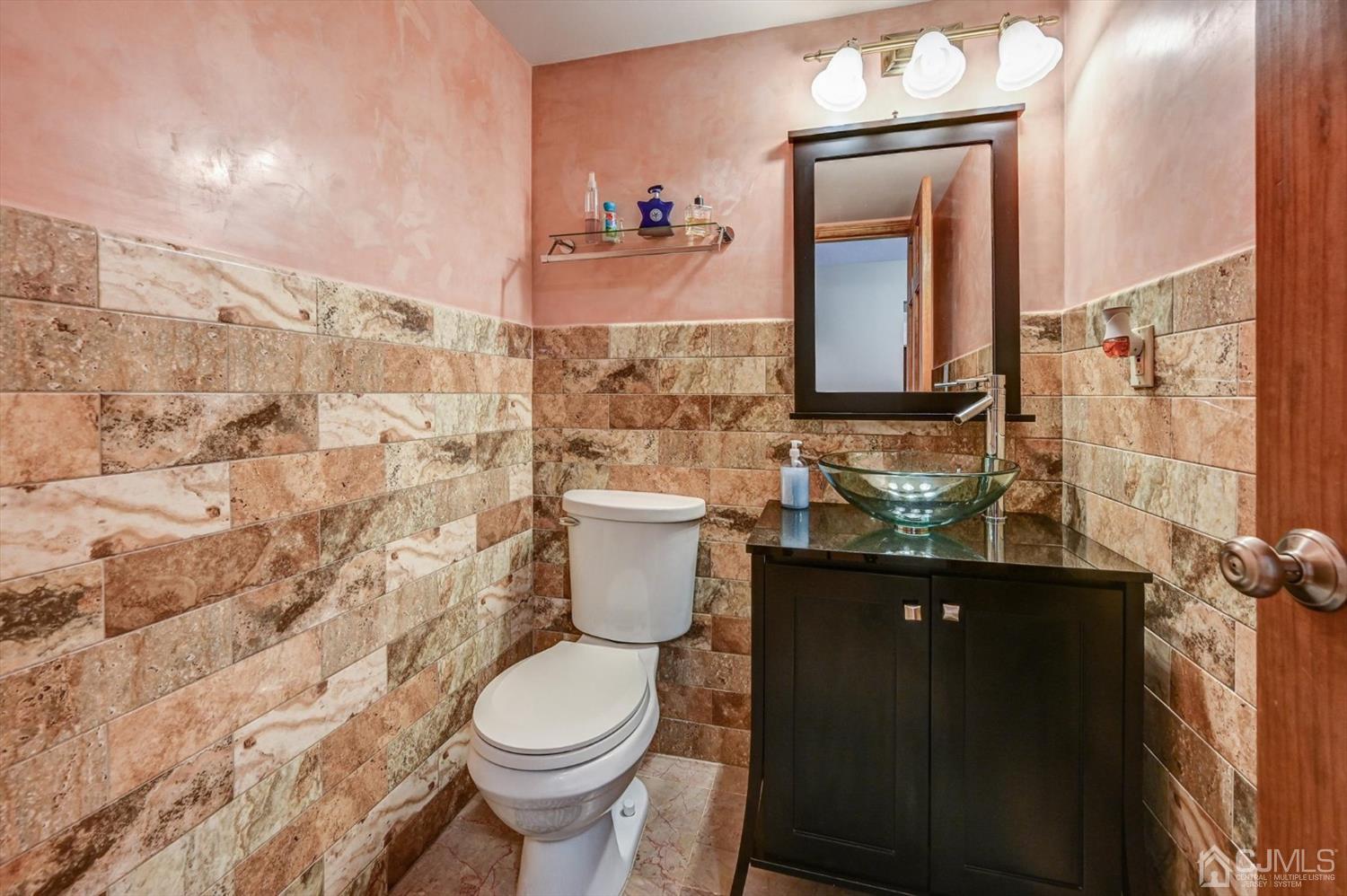 136 Redpine Loop Old Bridge, NJ 08857 - Photo 17 of 31 a bathroom with a toilet sink and mirror