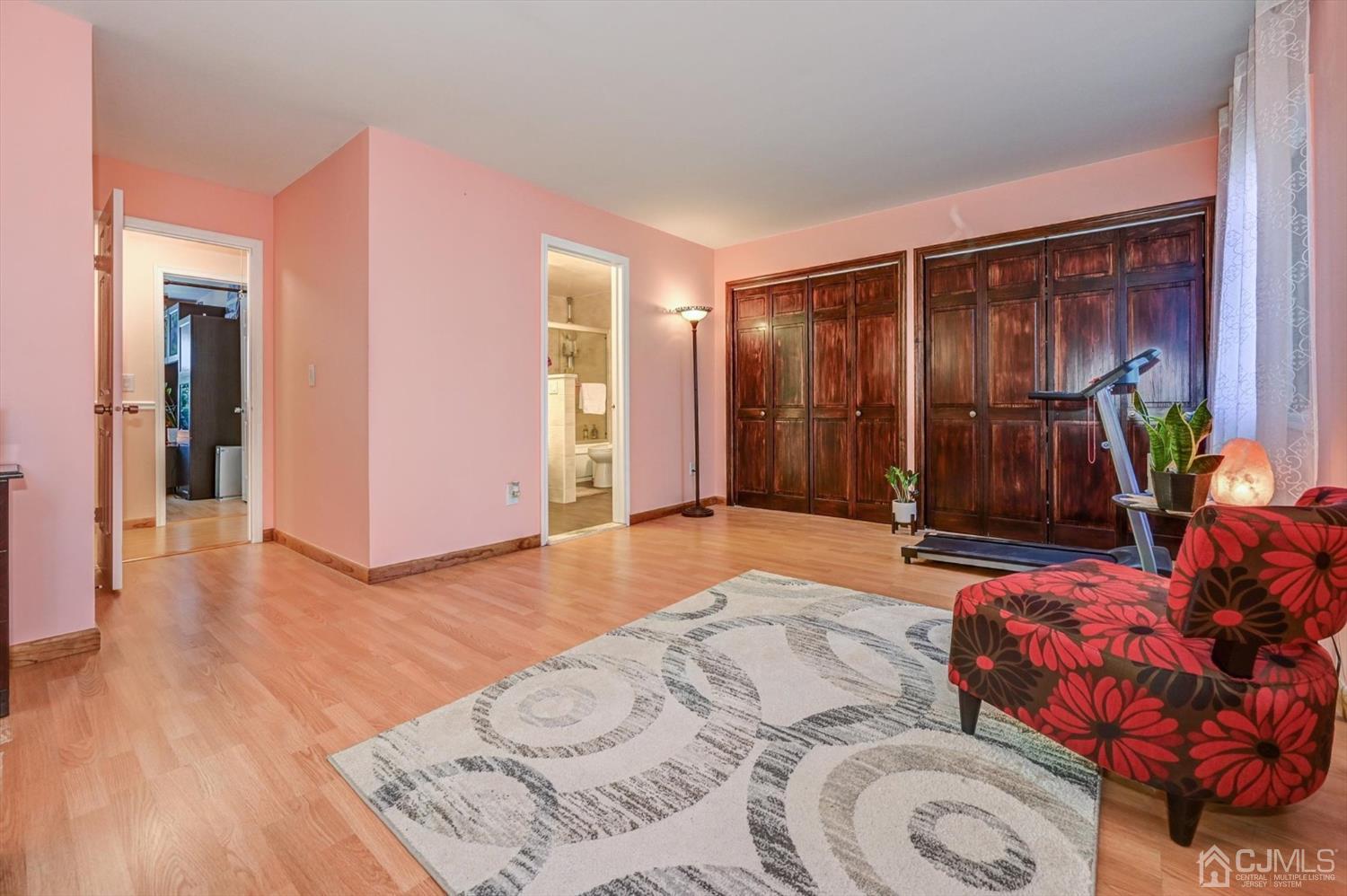 136 Redpine Loop Old Bridge, NJ 08857 - Photo 19 of 31 a bedroom with a bed and wooden floor