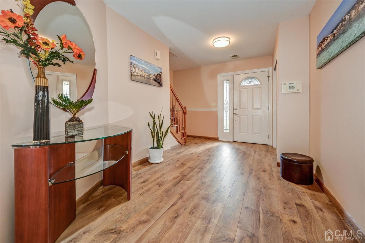 136 Redpine Loop Old Bridge, NJ 08857 - Photo 3 of 31 a view of livingroom with furniture and wooden floor