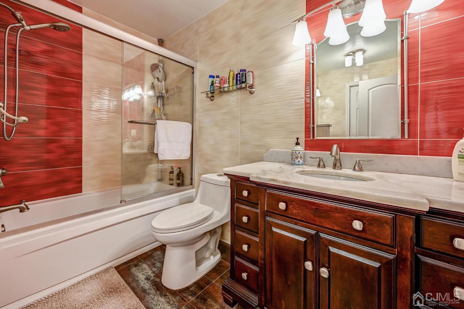 136 Redpine Loop Old Bridge, NJ 08857 - Photo 22 of 31 a bathroom with a granite countertop toilet sink and a shower