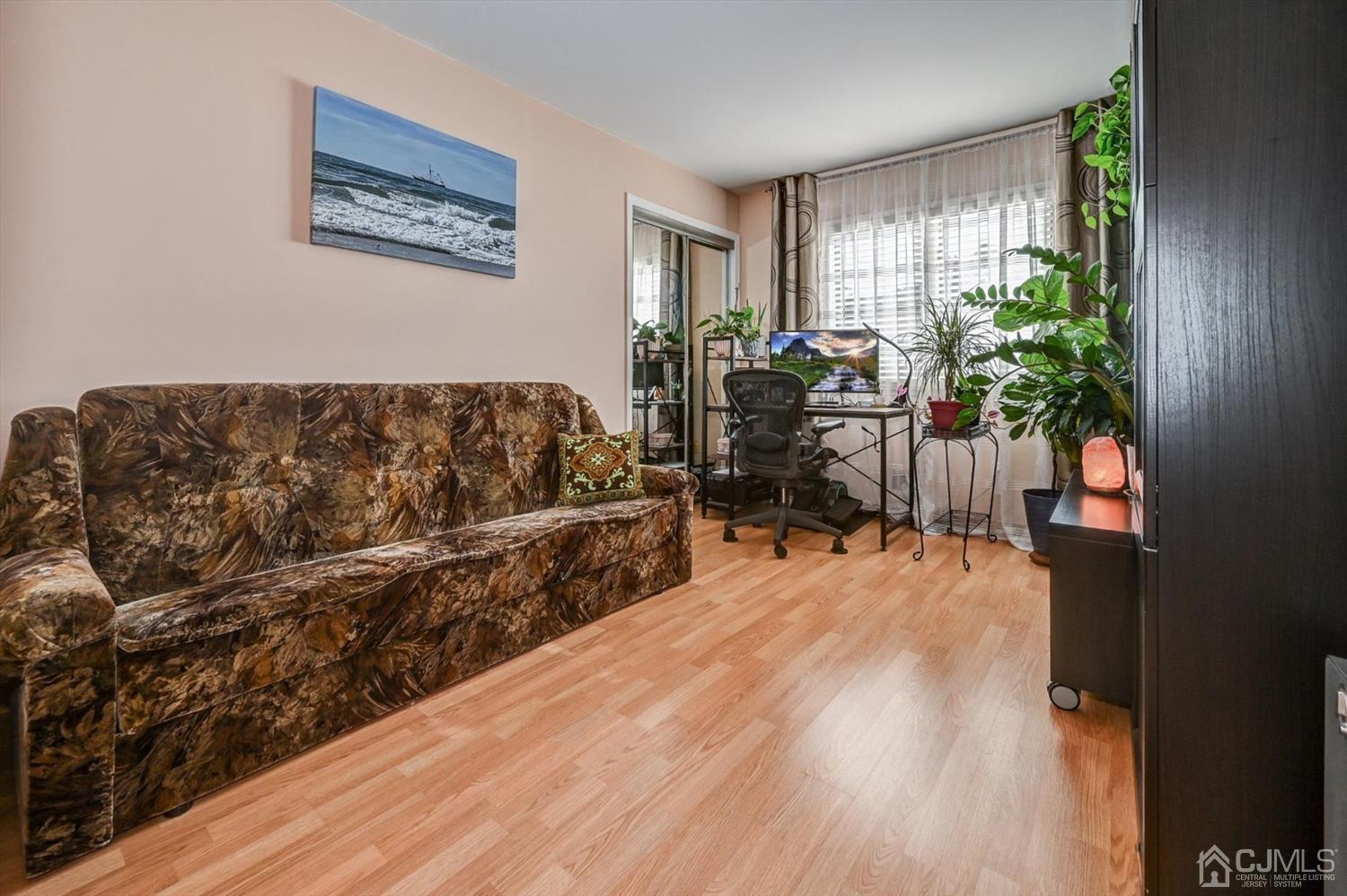 136 Redpine Loop Old Bridge, NJ 08857 - Photo 24 of 31 a living room with furniture and a potted plant
