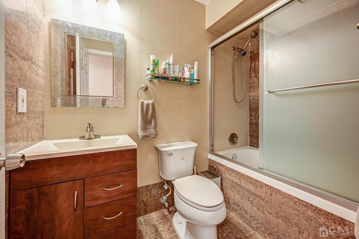 136 Redpine Loop Old Bridge, NJ 08857 - Photo 25 of 31 a bathroom with a sink toilet and shower