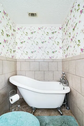 a white bath tub sitting in a bathroom