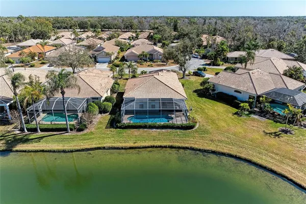 an aerial view of a house with a lake view
