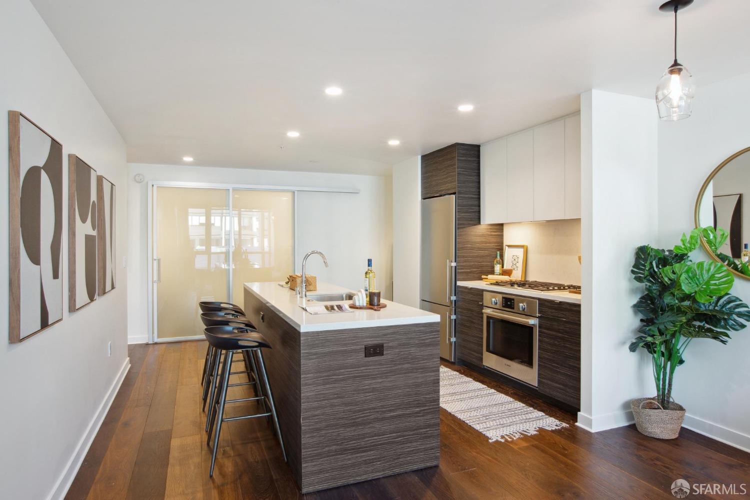 1688 Pine Street, Unit E601 San Francisco, CA 94109 - Photo 11 of 51 a kitchen with sink a microwave and refrigerator