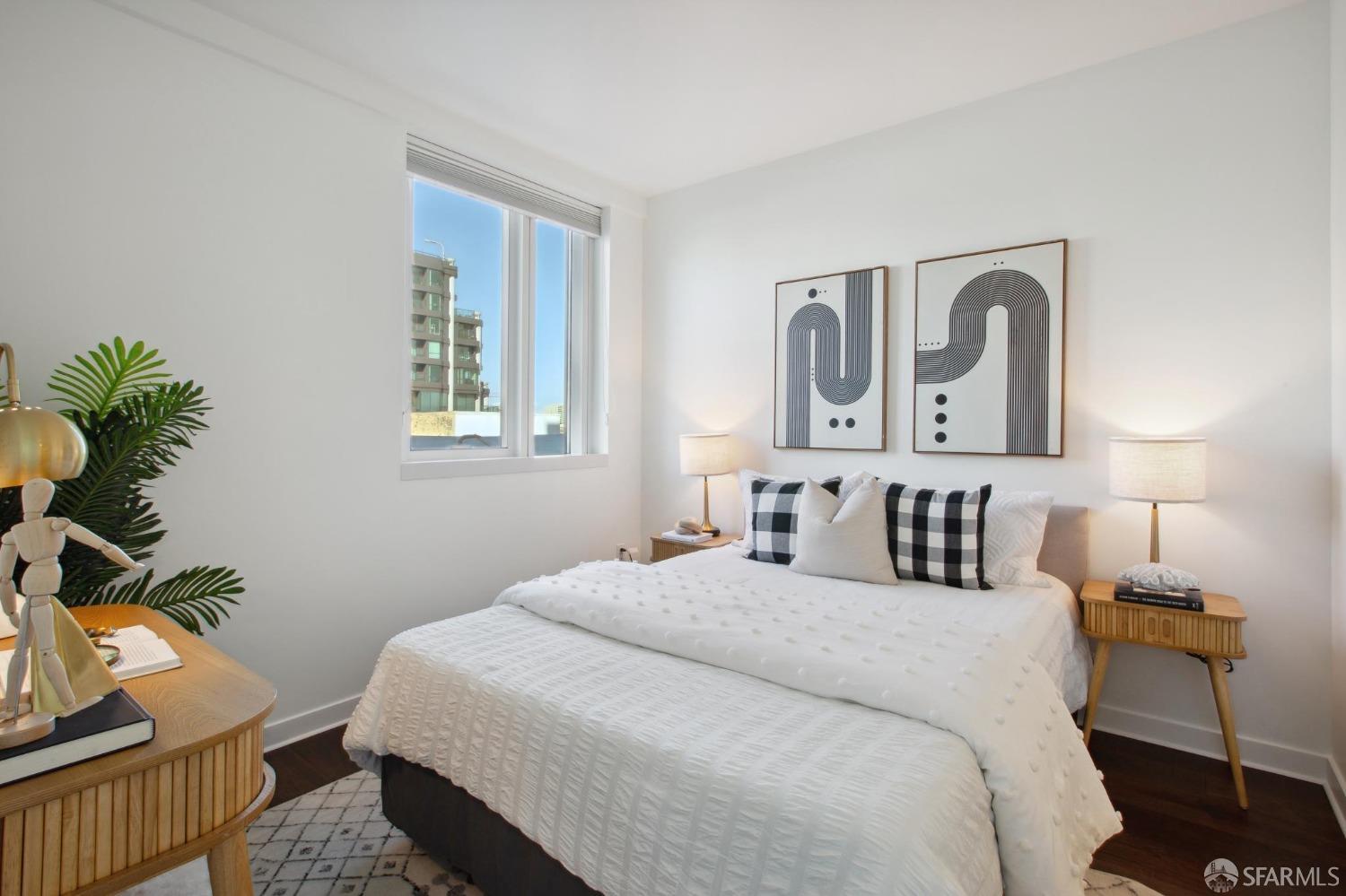 1688 Pine Street, Unit E601 San Francisco, CA 94109 - Photo 13 of 51 a bedroom with a bed and a potted plant