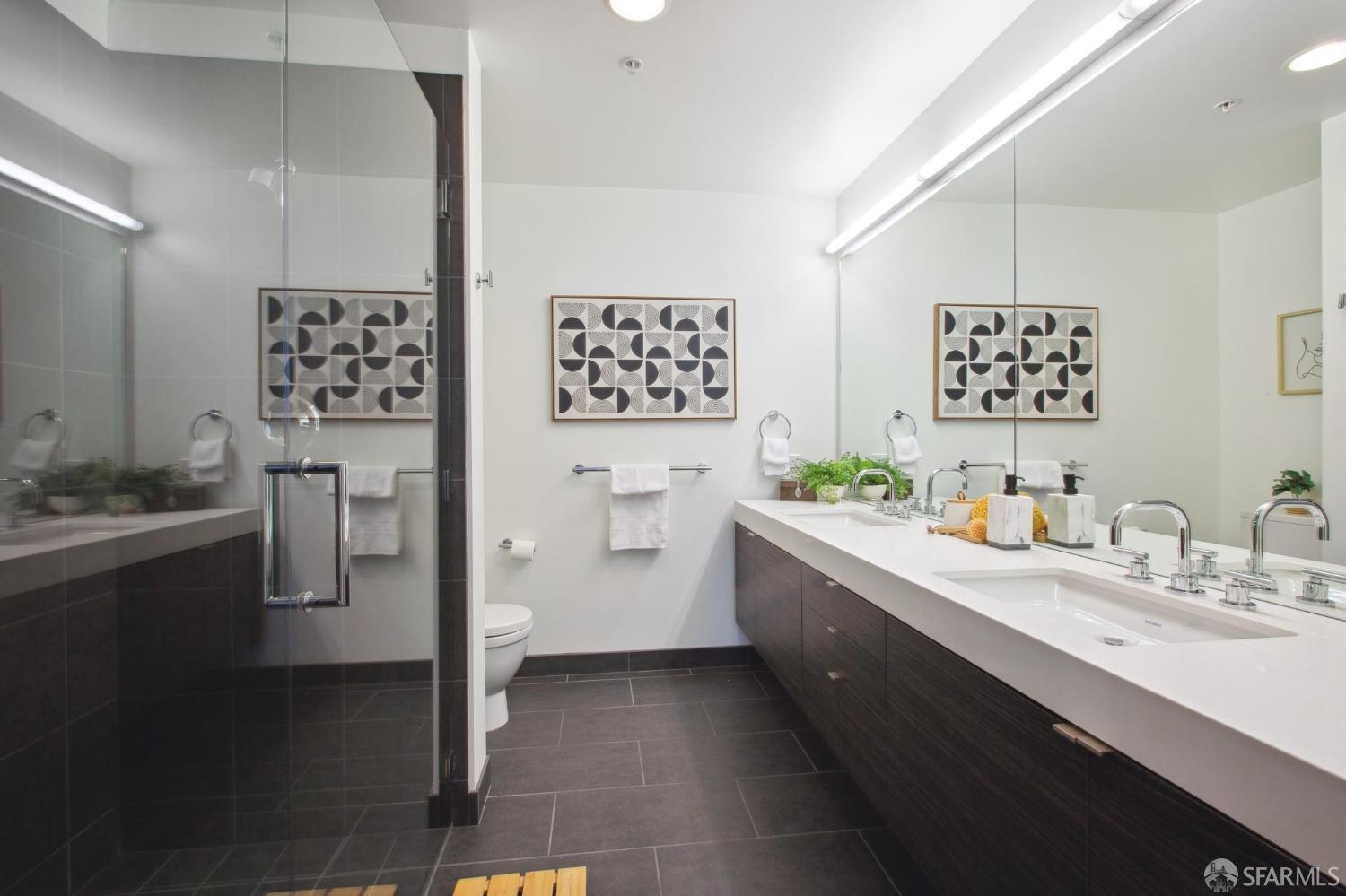 1688 Pine Street, Unit E601 San Francisco, CA 94109 - Photo 16 of 51 a bathroom with double vanity sink and mirror
