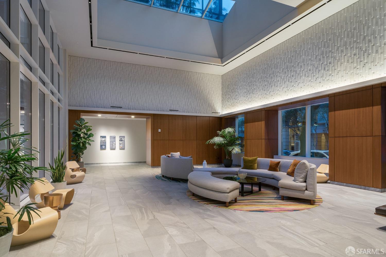 1688 Pine Street, Unit E601 San Francisco, CA 94109 - Photo 29 of 51 a living room with furniture and a potted plant