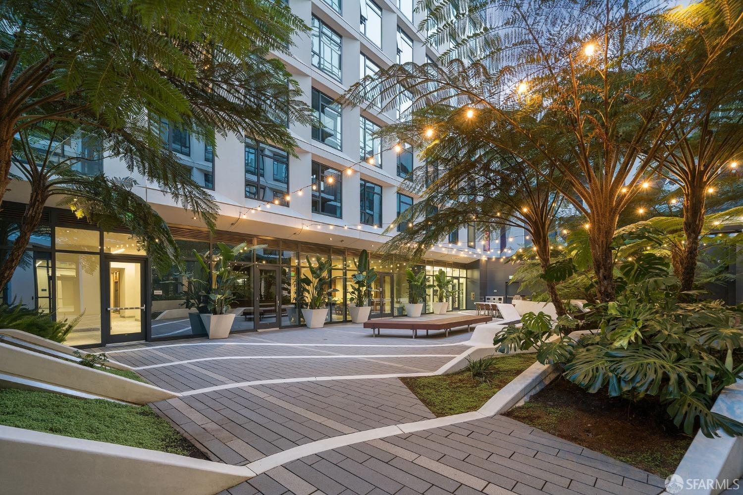 1688 Pine Street, Unit E601 San Francisco, CA 94109 - Photo 30 of 51 a front view of a building with lots of trees and plants