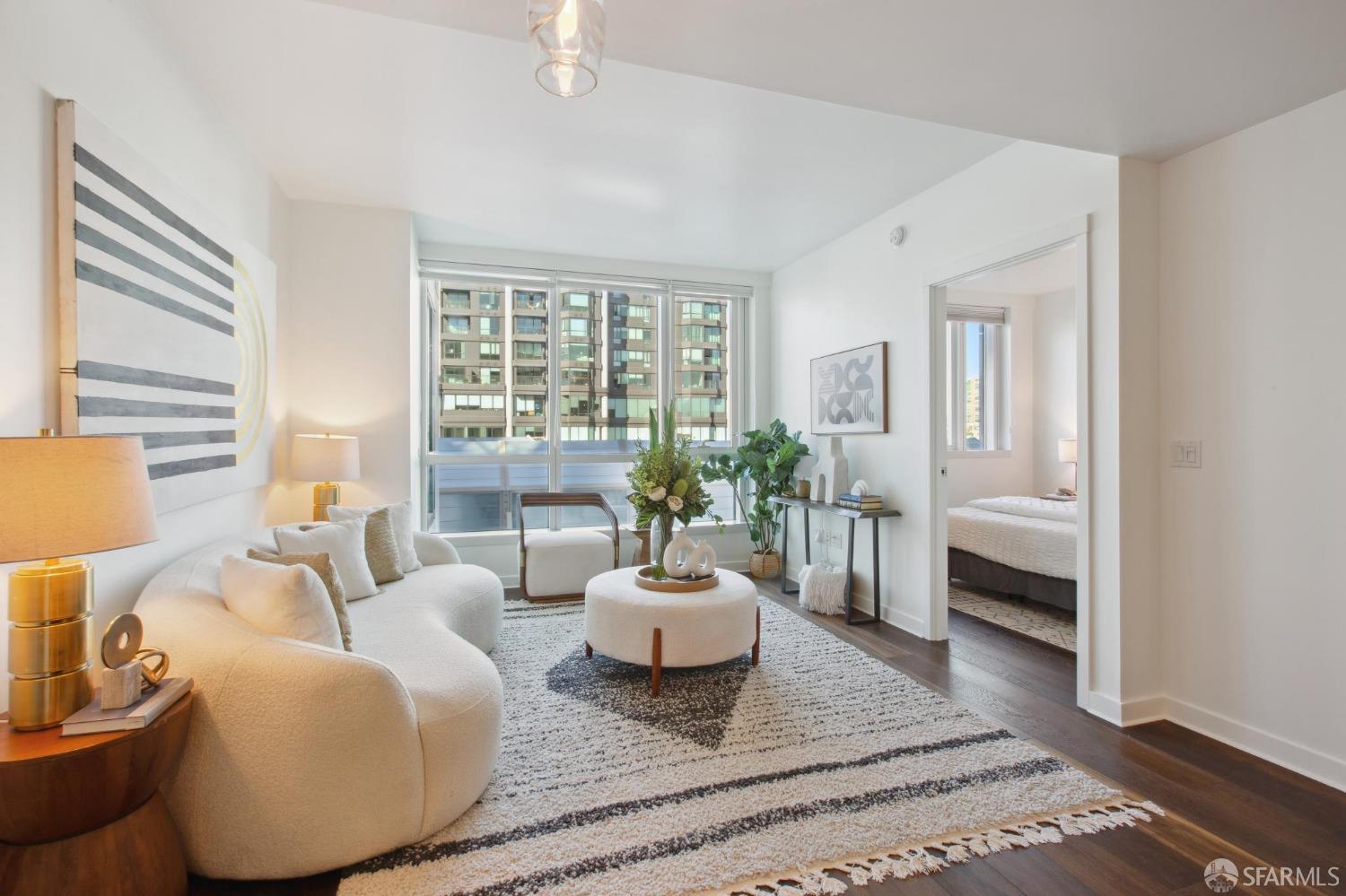 1688 Pine Street, Unit E601 San Francisco, CA 94109 - Photo 4 of 51 a living room with furniture and a large window