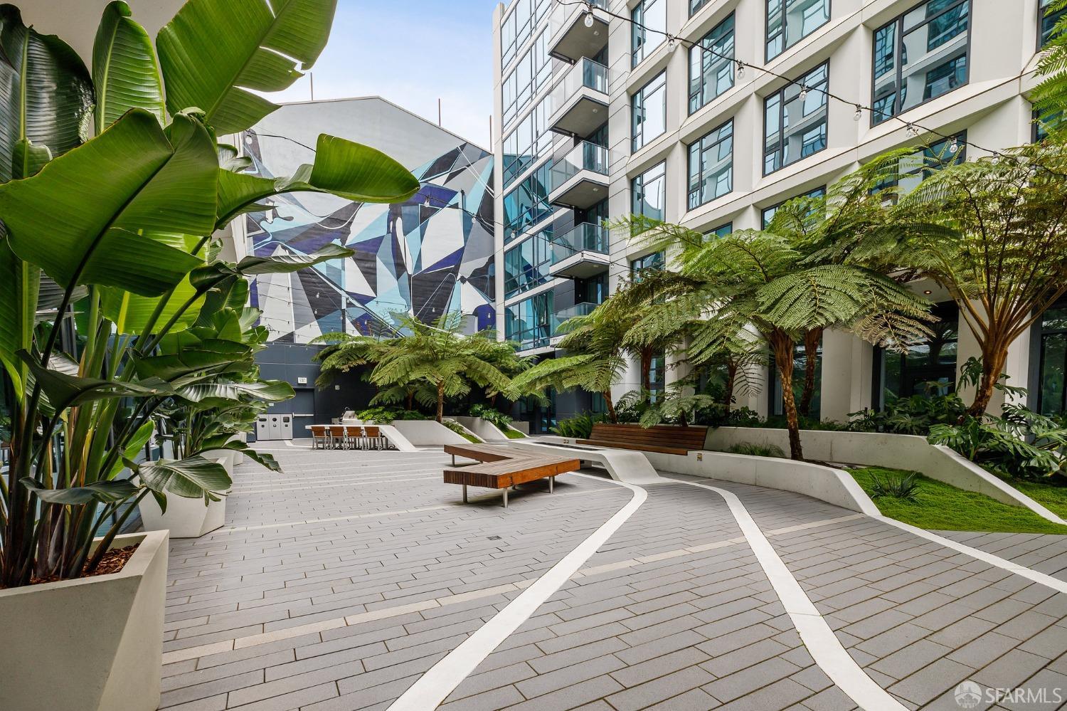 1688 Pine Street, Unit E601 San Francisco, CA 94109 - Photo 41 of 51 a row of palm trees in front of a building