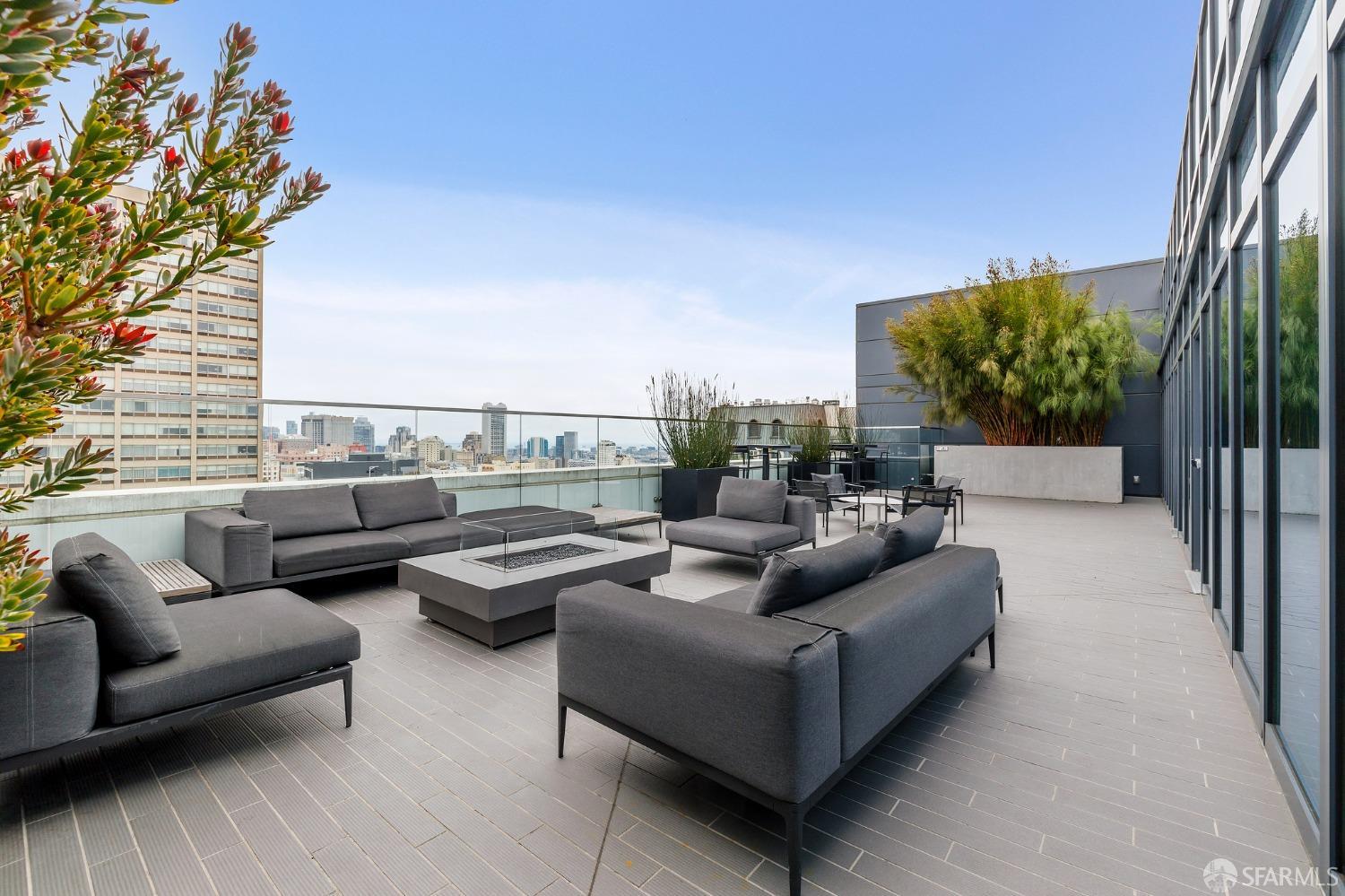 1688 Pine Street, Unit E601 San Francisco, CA 94109 - Photo 48 of 51 a terrace with couches and a potted plant on a table