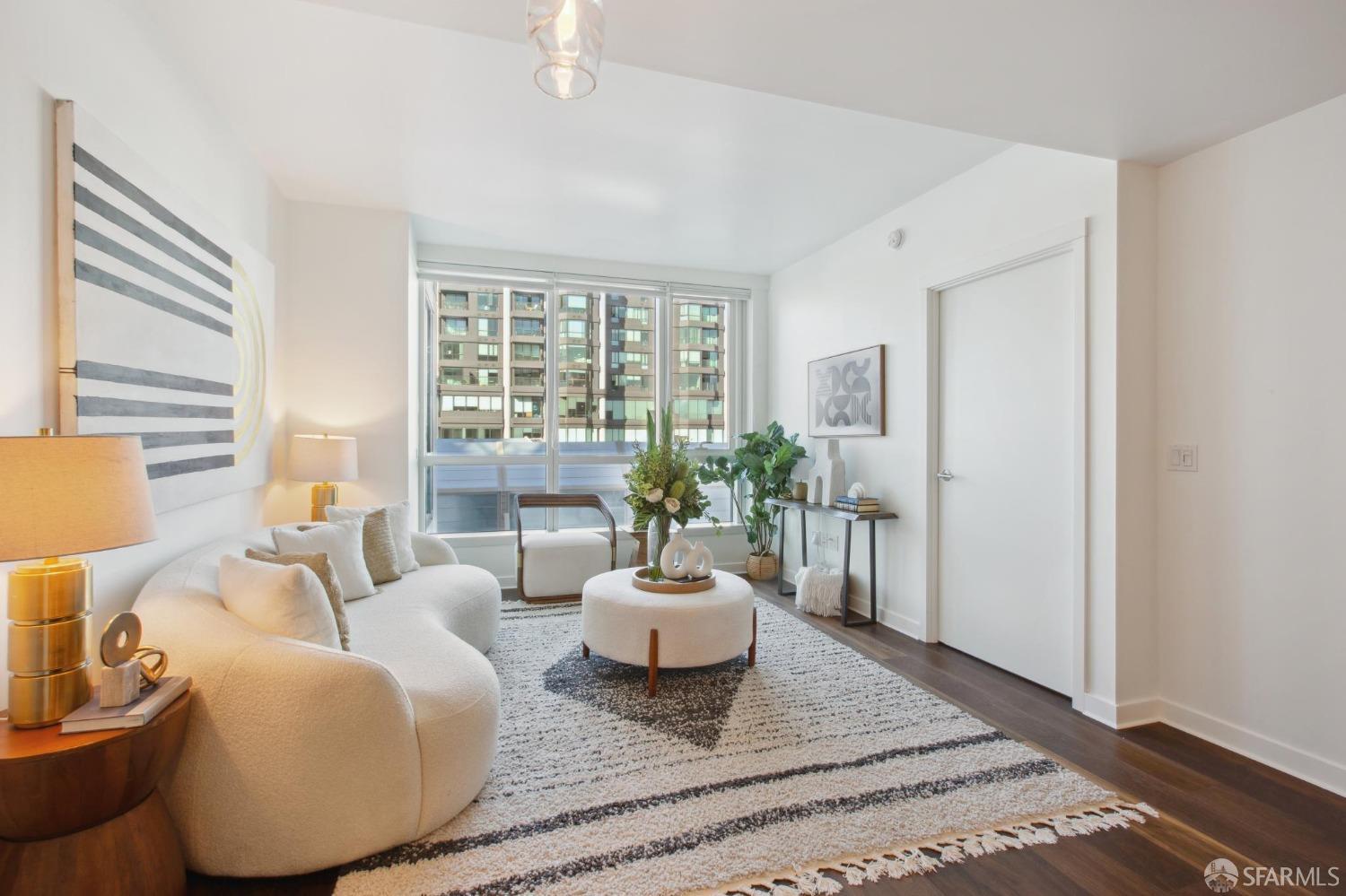 1688 Pine Street, Unit E601 San Francisco, CA 94109 - Photo 5 of 51 a living room with furniture and a large window