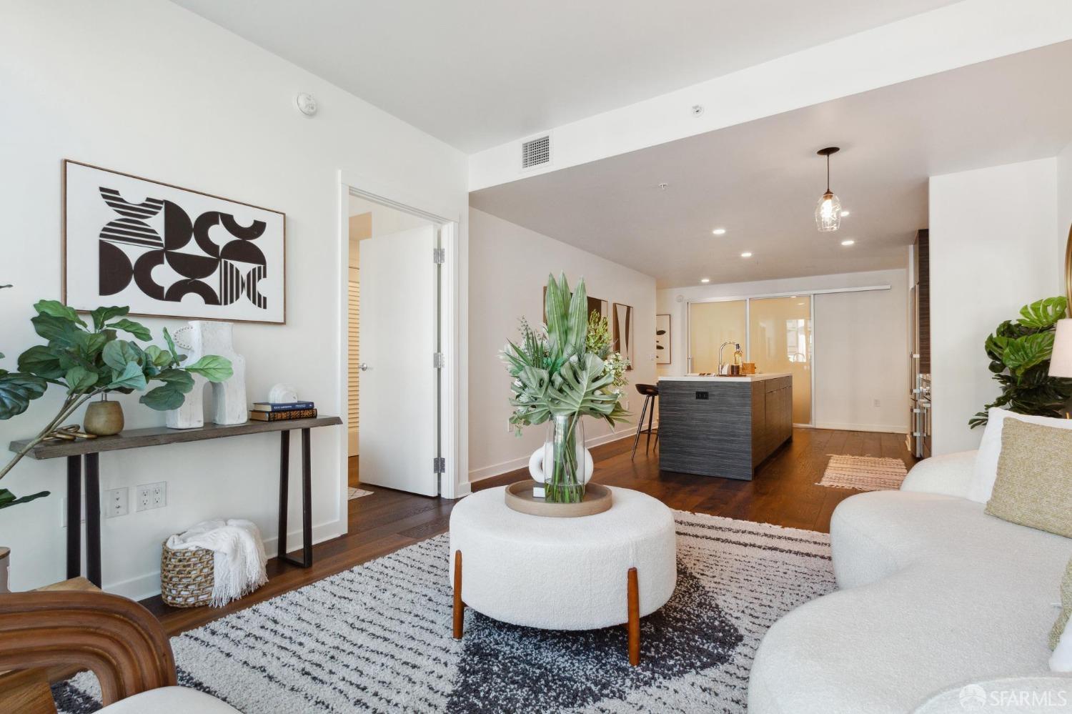 1688 Pine Street, Unit E601 San Francisco, CA 94109 - Photo 6 of 51 a living room with furniture and a potted plant