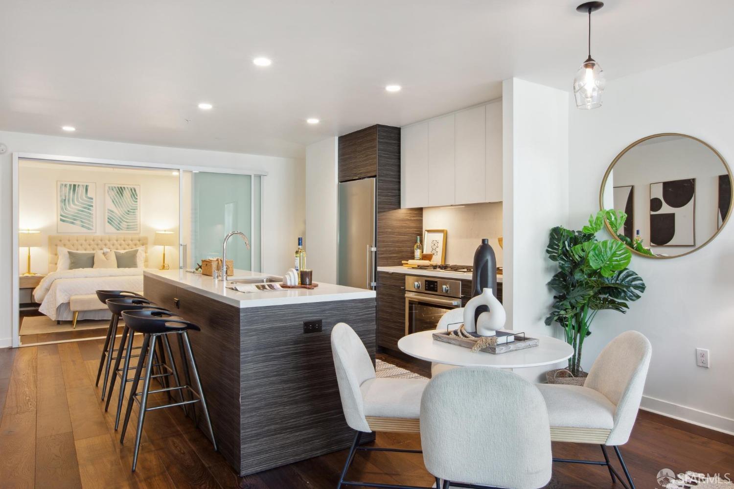 1688 Pine Street, Unit E601 San Francisco, CA 94109 - Photo 9 of 51 a kitchen with a table chairs stove and cabinets