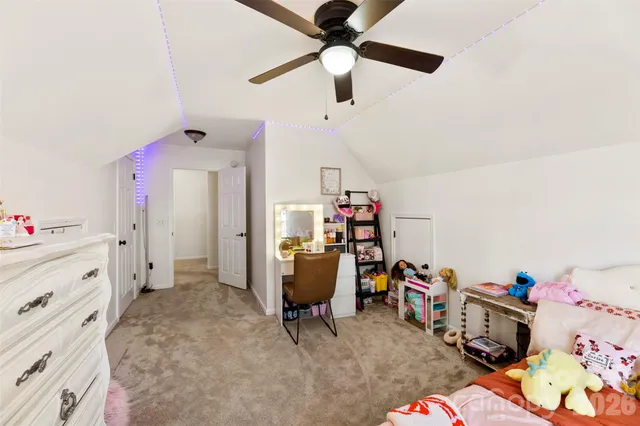 a view of a workspace with furniture and toys