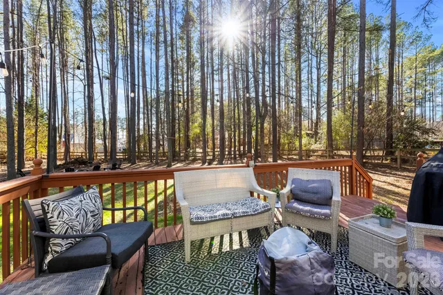 a balcony with table and chairs