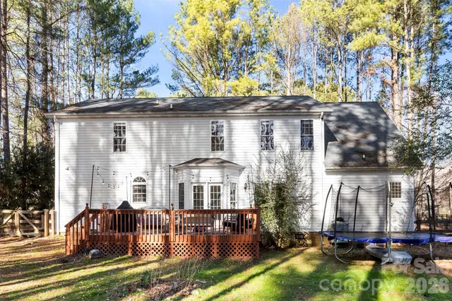 a front view of house with a garden