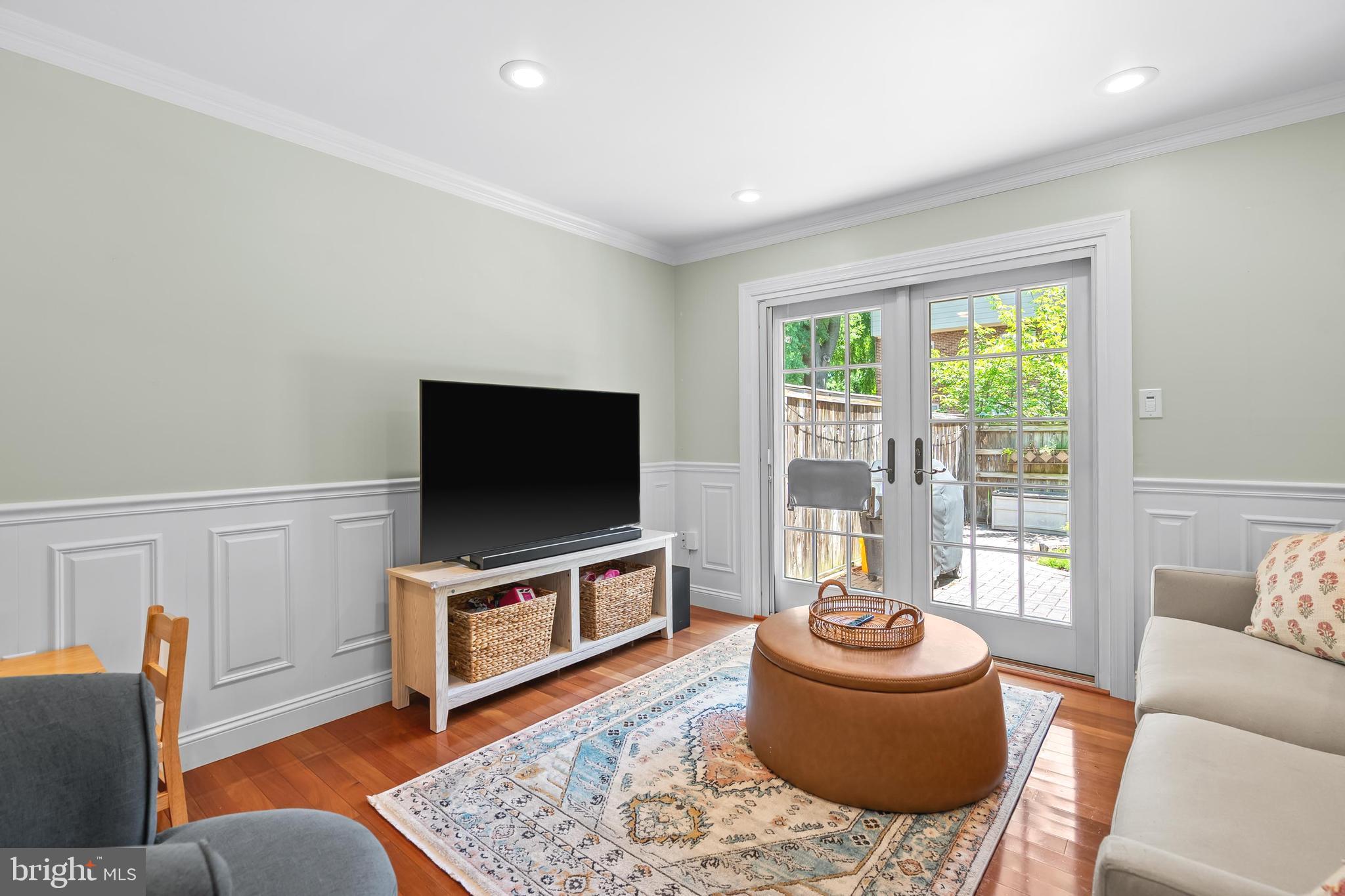 7029 Leewood Forest Drive Springfield, VA 22151 - Photo 16 of 45 a living room with furniture and a flat screen tv