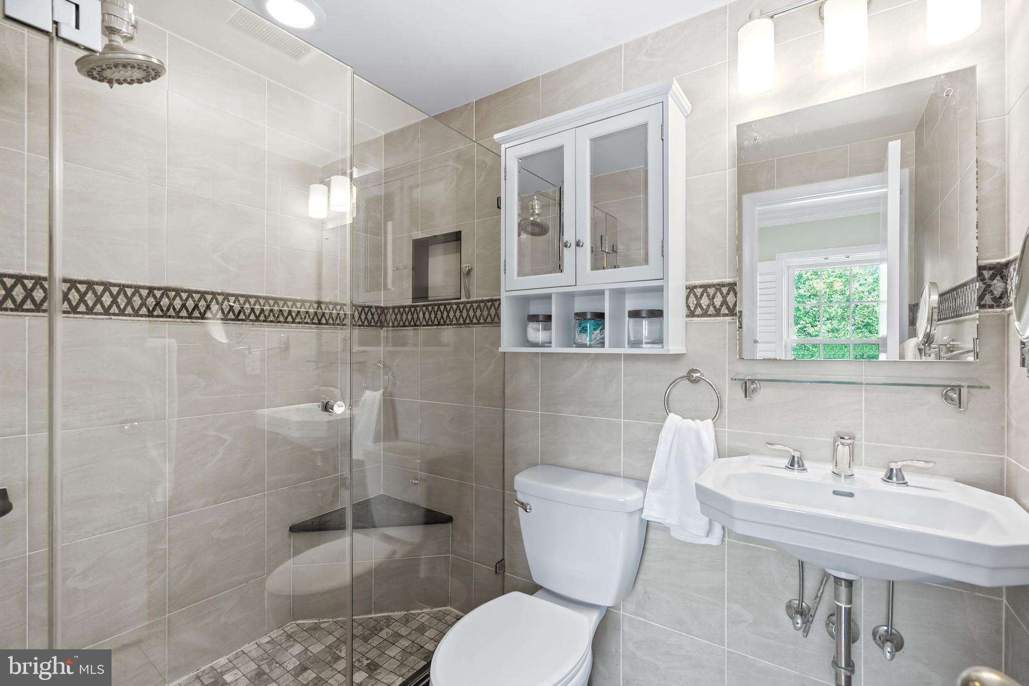 7029 Leewood Forest Drive Springfield, VA 22151 - Photo 23 of 45 a bathroom with a sink toilet and shower