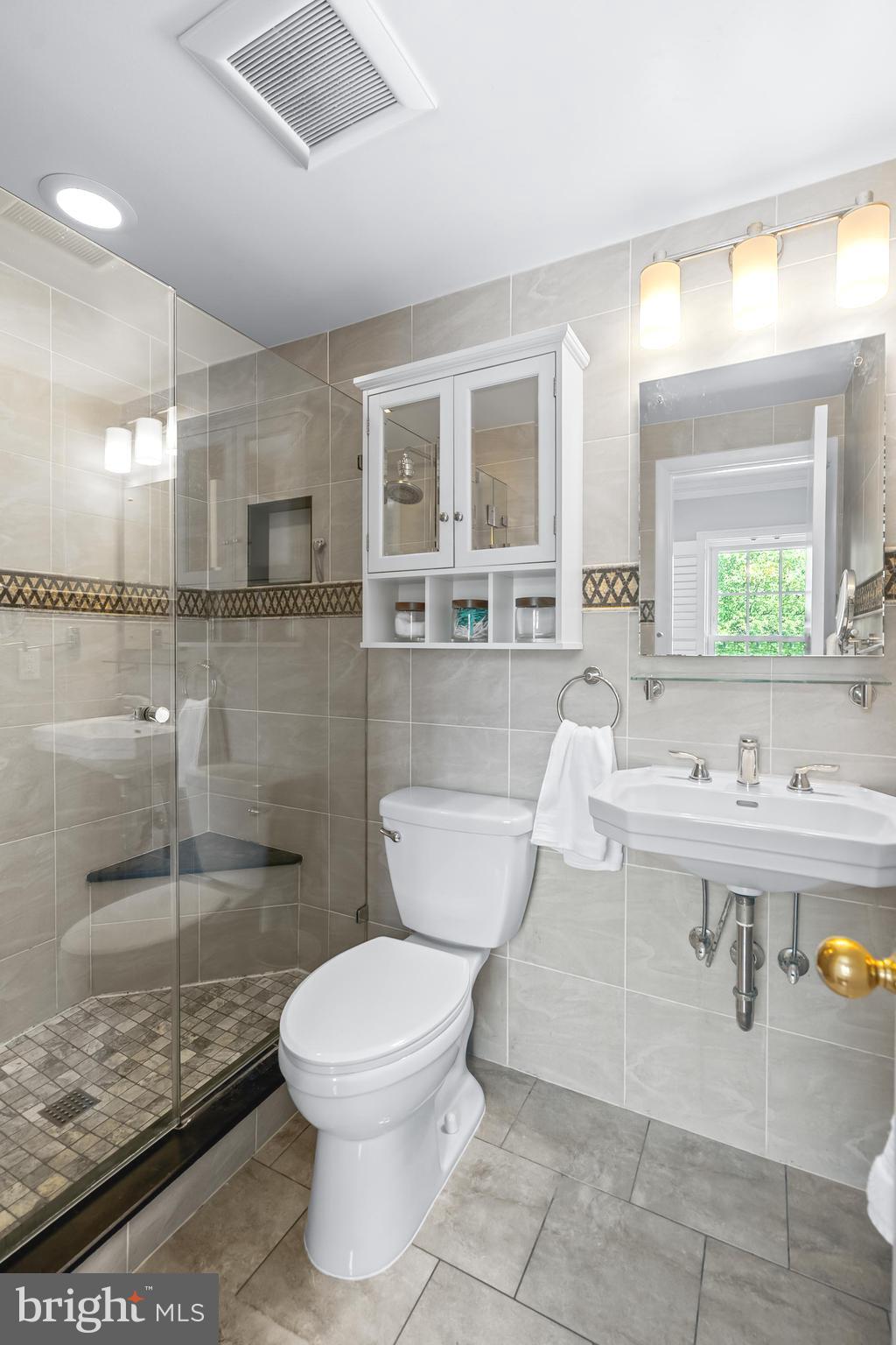 7029 Leewood Forest Drive Springfield, VA 22151 - Photo 24 of 45 a bathroom with a sink a toilet and shower